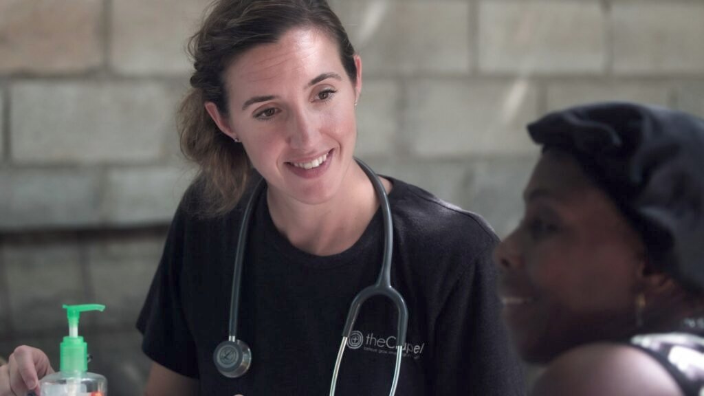 Nurse caring for a client at an IV drip bar