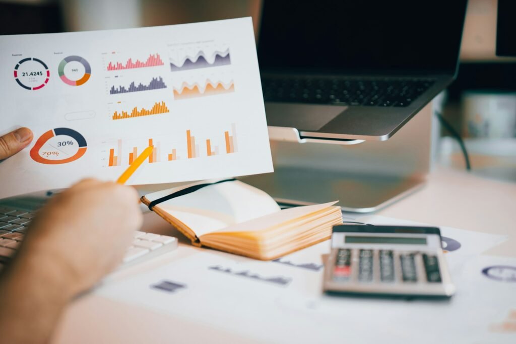 Monthly financial reports with charts and a calculator