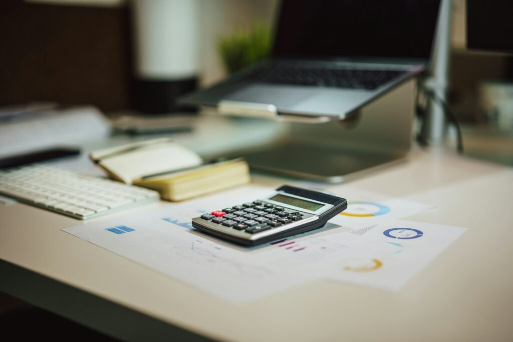 Organized desk with calculator after a bookkeeping clean-up