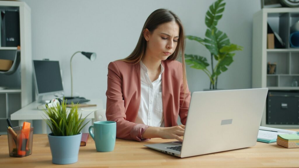 Practice owner learning bookkeeping software on a laptop