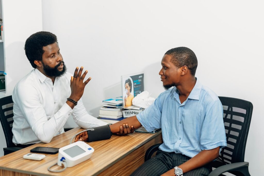 Practitioner talking with a patient at a wellness clinic